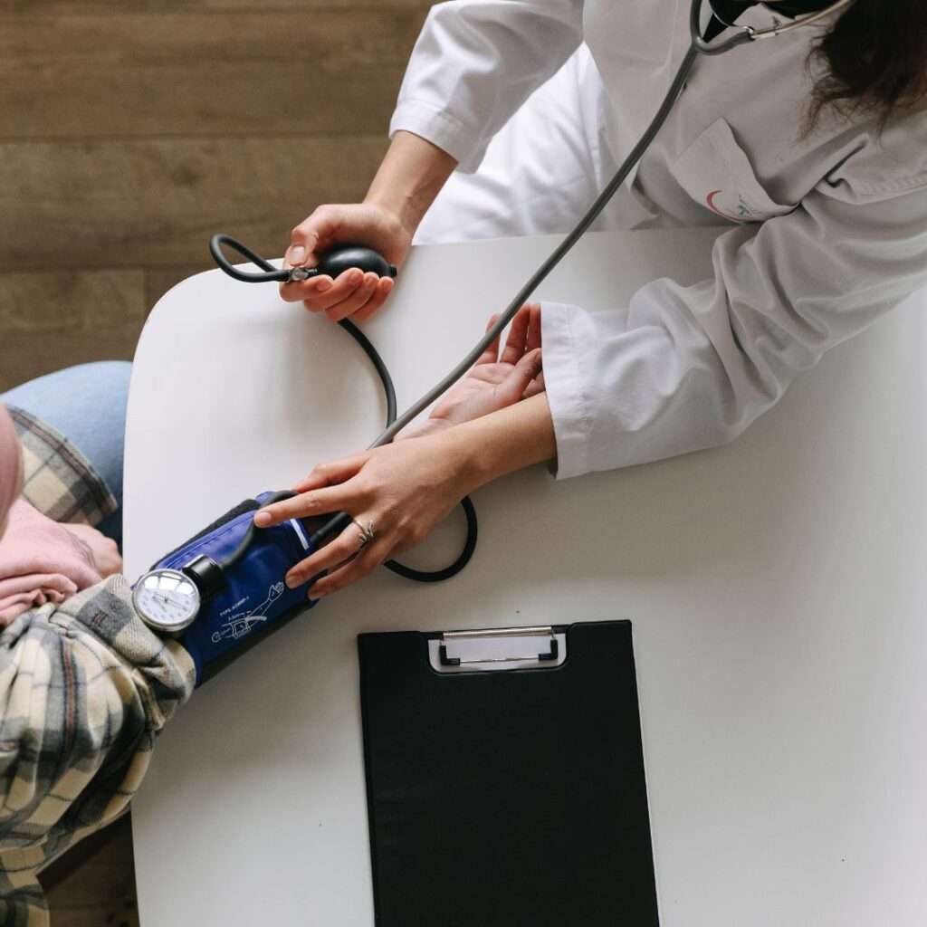 Doctor monitoring blood pressure